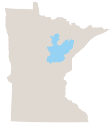 Map of Minnesota in gray with the north-central woodland area colored light blue.
