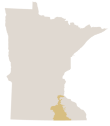 Map of Minnesota in gray with the southern woodland area known at the Oak Savanna colored yellow.